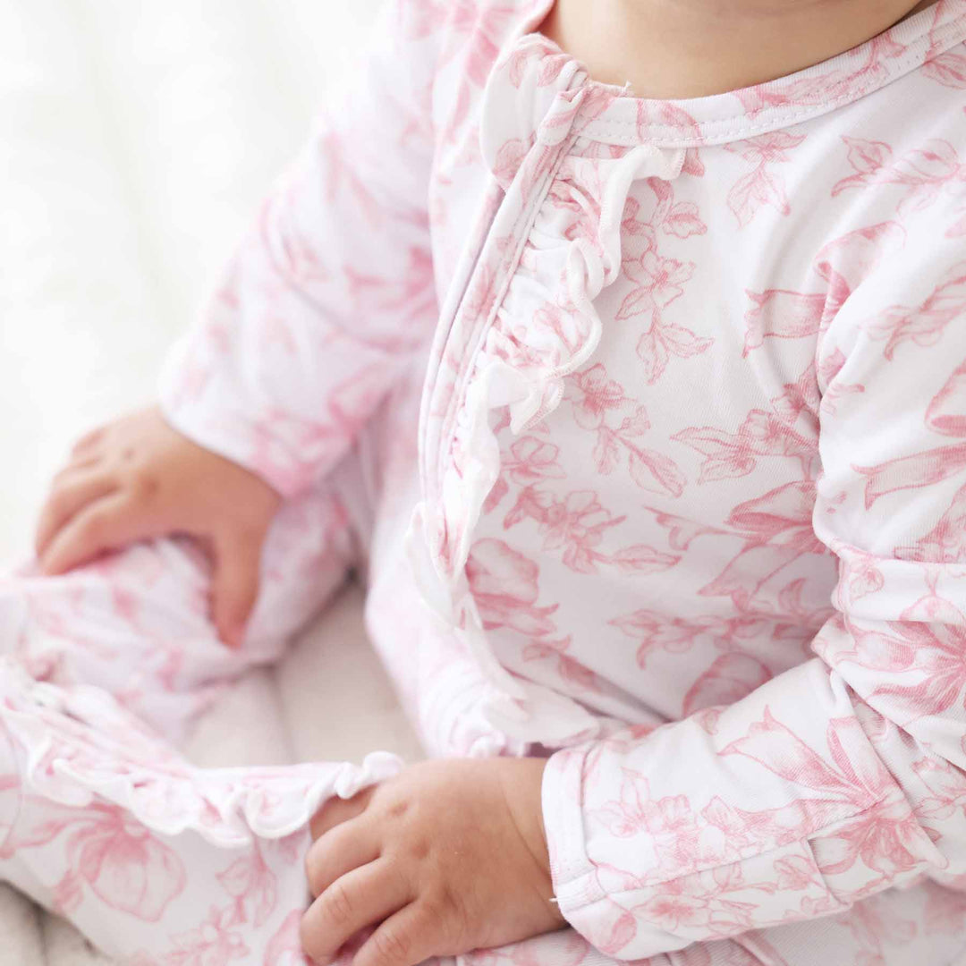 Pink Fancy Frills Bows Ruffle Zipper Footie - Caden Lane