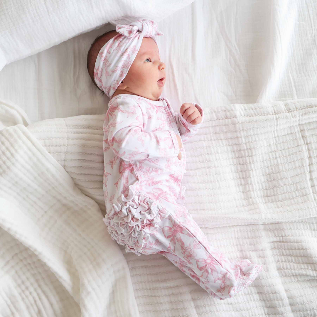 Pink Fancy Frills Bows Ruffle Zipper Footie - Caden Lane