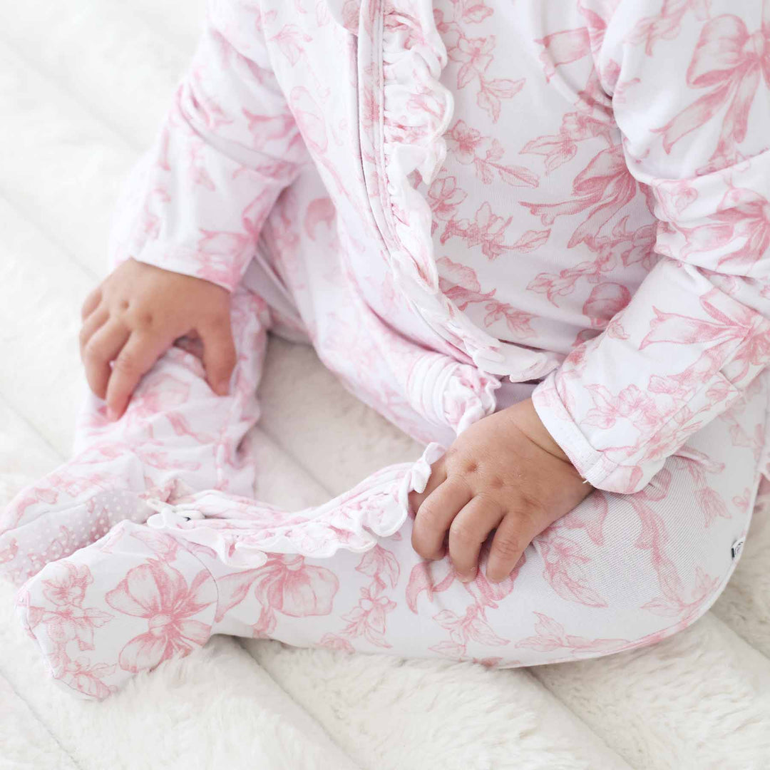 Pink Fancy Frills Bows Ruffle Zipper Footie - Caden Lane