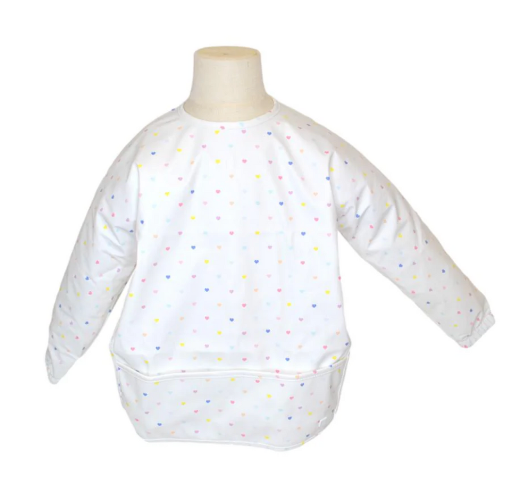 White bib with colorful heart dots on a mannequin against a white background