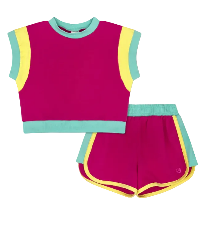 Children's two-piece outfit with pink top and shorts on a light gray background
