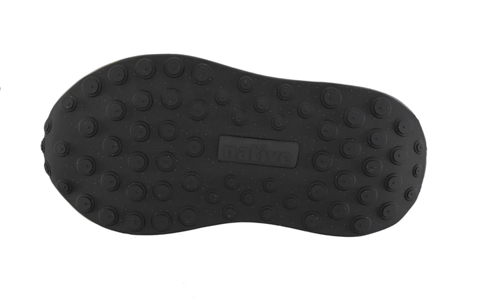 A dark gray athletic shoe sole with circular studs, shown from the bottom against a light gray digital inventory interface background.