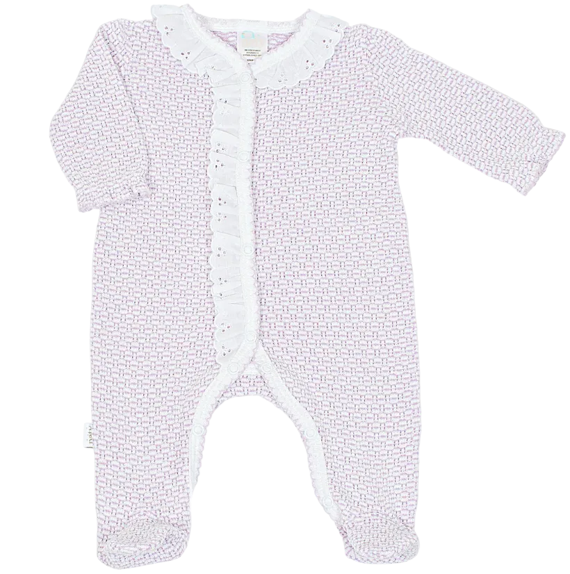 A baby long-sleeve footed sleeper in a light lavender and white geometric pattern, featuring a white ruffled collar and ruffled trim down the front snap closure.