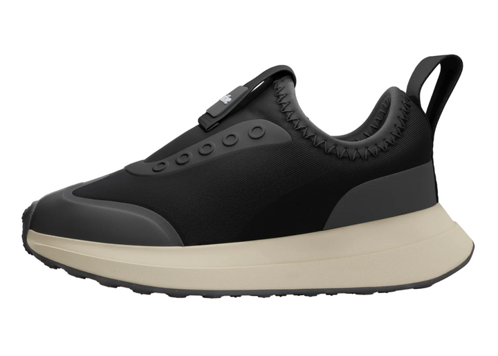 Black and beige sneaker on a gray background