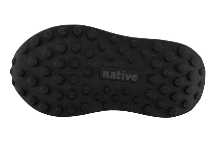 Black shoe sole with 'native' branding on a blurred background