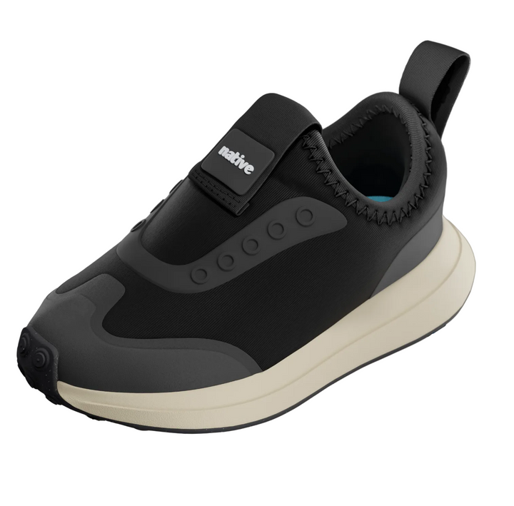 Black and beige sneaker with 'Native' branding on a gray background