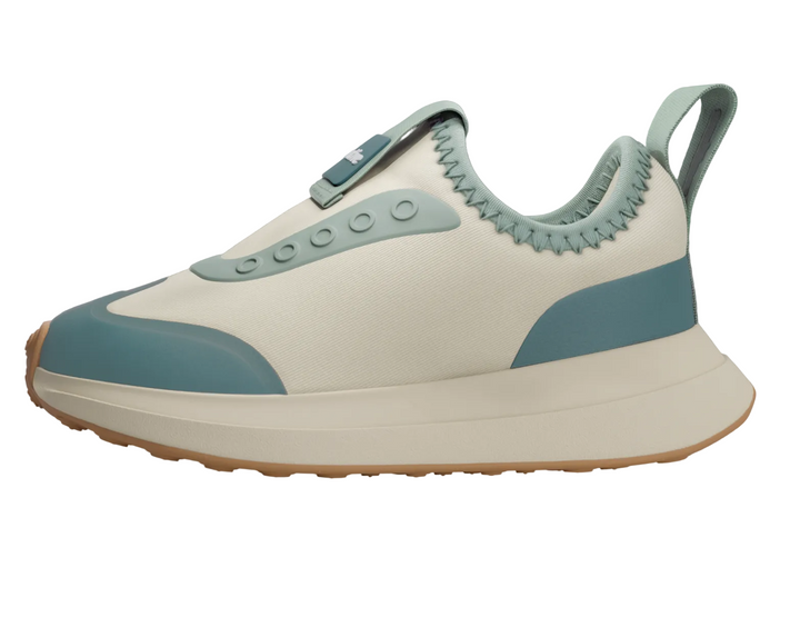 White and blue sneaker with a gray background