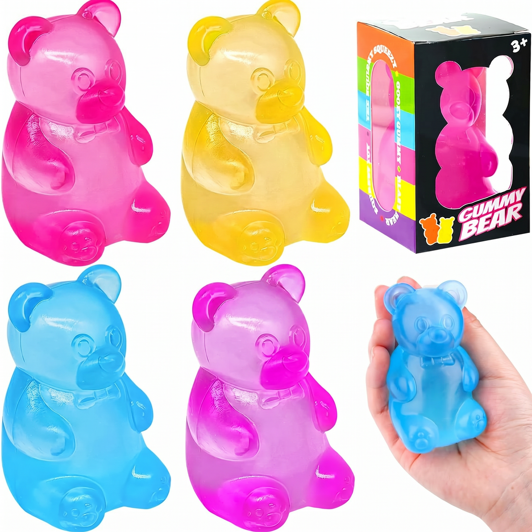 Colorful gummy bear toys with a hand holding a blue one, and packaging in the background.