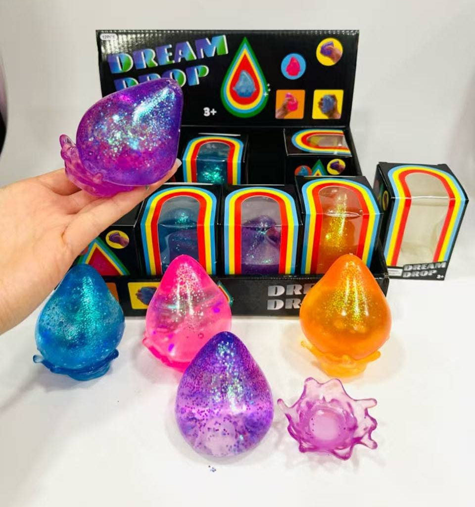 Colorful 'Dream Pop' toys with a box in the background