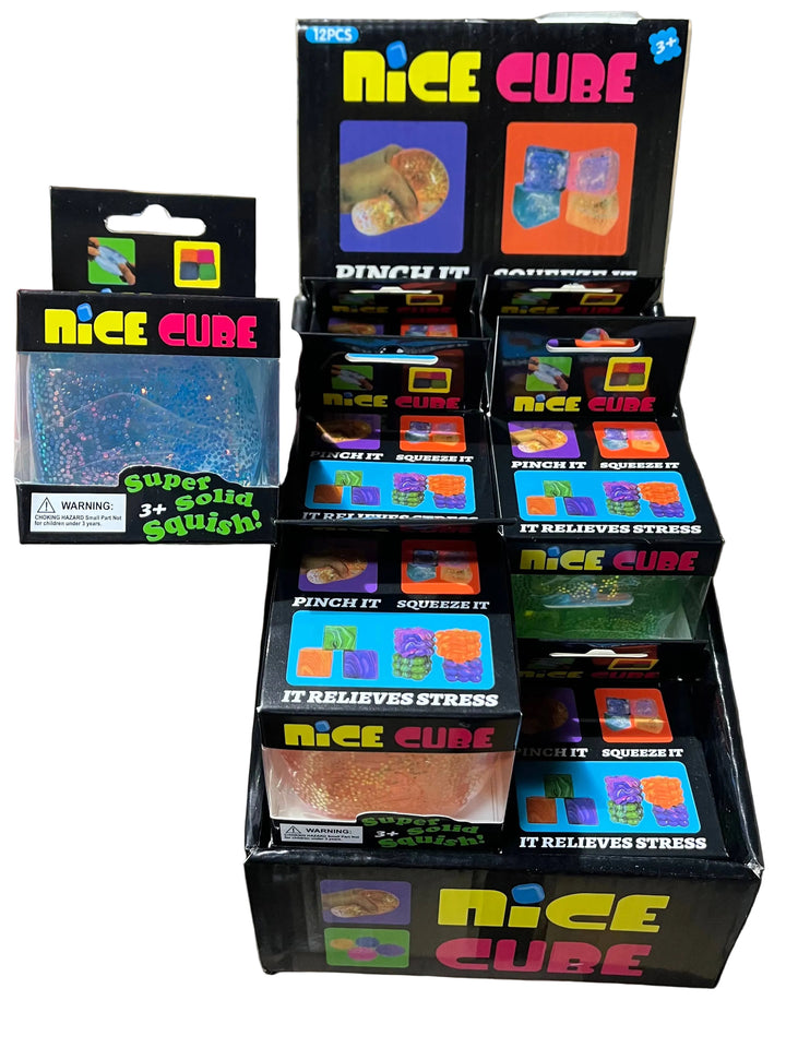 Multiple boxes of 'Nice Cube' stress relief product on a cardboard surface.