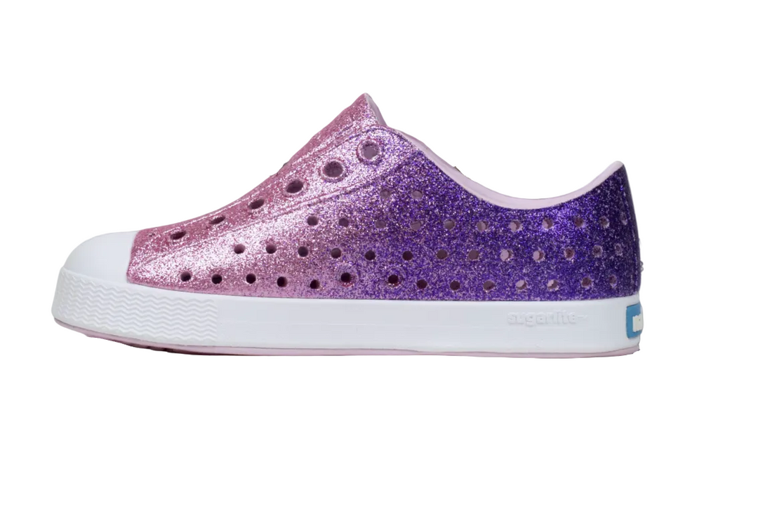 Purple glitter sneaker with white sole on a gray background