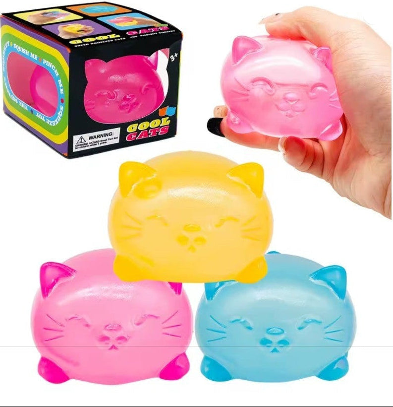 Colorful cat-shaped toys with a hand holding one, displayed against a white background.
